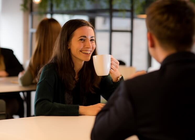 lady having a meeting drinking coffee