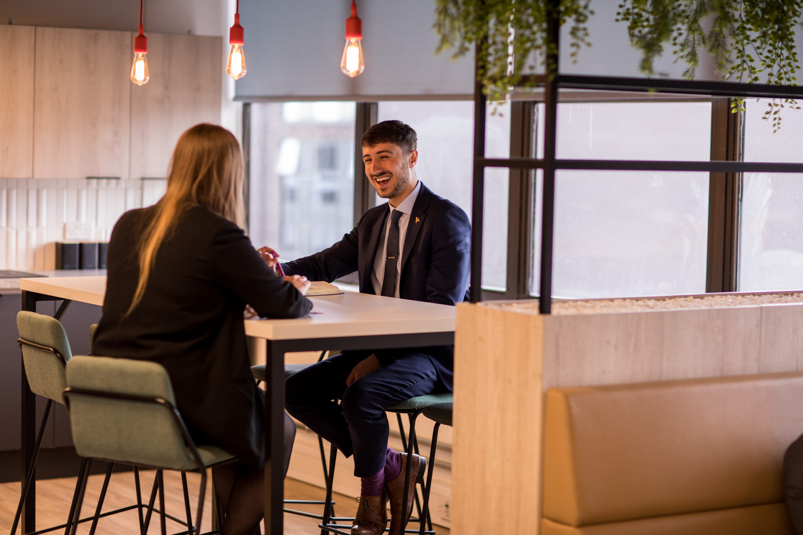 2 people at desk having a meeting