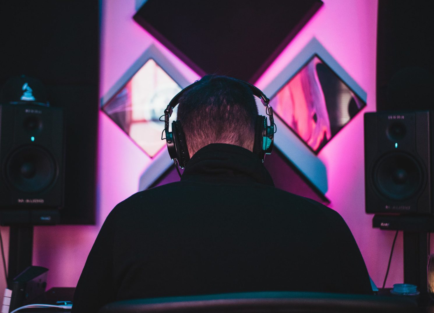 behind photo of a man in headphones